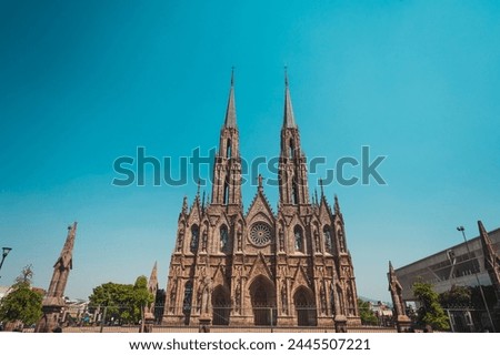 Exteriors during the afternoon of the Cathedral "Diocesan Sanctuary of Our Lady of Guadalupe" of Zamora Michoacan, shows Gothic style architecture. Royalty-Free Stock Photo #2445507221