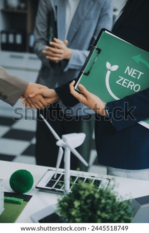 Carbon offset price report CO2 emission. Future growth Net zero waste in ESG ethical SME office protect climate change global warming social issues project. Group of asia people Eco friendly SDGs plan Royalty-Free Stock Photo #2445518749