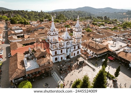 Aerial view of the San Cristobal church in Mazamitla, Mazamitla's downtown garden  Royalty-Free Stock Photo #2445524009