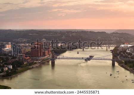 Covington Kentucky. Evening urban landscape of downtown district in USA. Skyline with bridge traffic and brightly illuminated high skyscraper buildings in modern American city