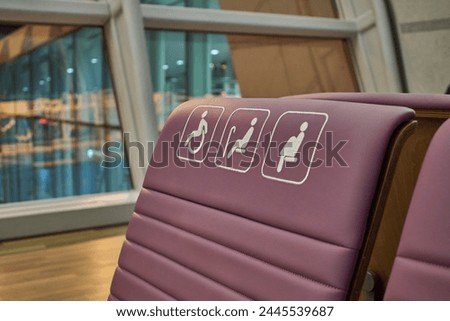 Disabled Handicap sign on a chair reserved for people with disabilities, elderly and pregnant women