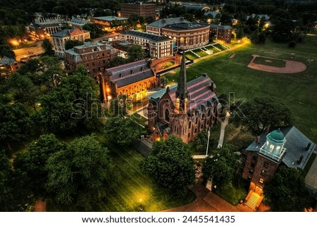 Aerial view of Memorial Chapel at Wesleyan University in Middletown Connecticut at dusk Royalty-Free Stock Photo #2445541435