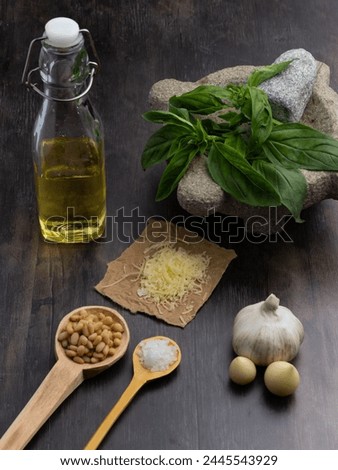 Explore Genovese pesto essence in our captivating stock photo, showcasing fresh ingredients against a rustic backdrop. Perfect for culinary blogs and projects.
