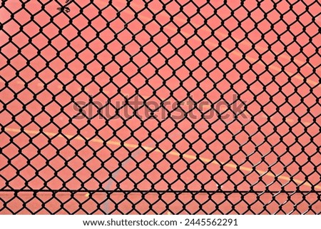 chainlink fence at tennis court Royalty-Free Stock Photo #2445562291
