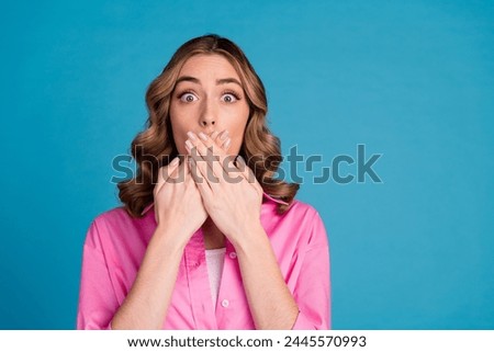 Photo portrait of lovely young lady cover mouth frightened dressed stylish pink garment hairdo isolated on blue color background