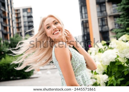 Photo of adorable charming lovely girl going store mall centre walking windy sunny warm weather outdoors