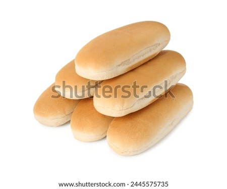 Many fresh hot dog buns isolated on white
