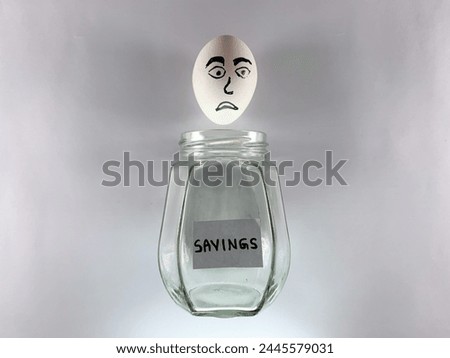 Zero savings concept. A white sad egg coming out of an empty savings glass jar. Market sketch of happy cartoon on an egg isolated on white paper.