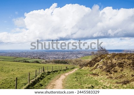 Looking down on on the town of Macclesfield pictured from the top of a pathway in Tegg's Nose Country Park.