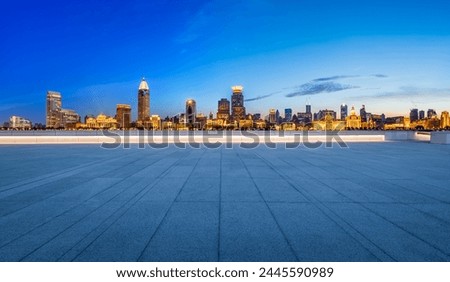 City Square floor and Shanghai skyline with modern buildings at night. Famous Bund buildings in Shanghai. 
