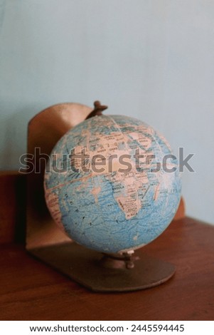 an old globe is used as a display