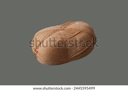 Skein of wool yarn, beige color on an isolated background.