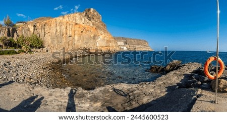 Panoramic of the cove or Caleta of the touristic coastal town Mogan in the south of Gran Canaria in summer. Spain