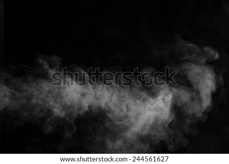 Abstract smoke moves on black background Royalty-Free Stock Photo #244561627
