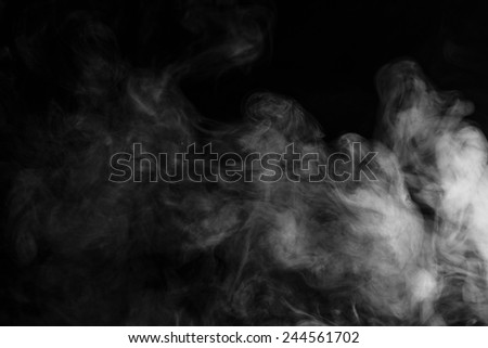 Abstract smoke moves on a black background Royalty-Free Stock Photo #244561702