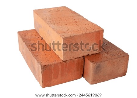 solid fireproof clay brick used for the construction of fireplaces and stoves, on an isolated white background Royalty-Free Stock Photo #2445619069