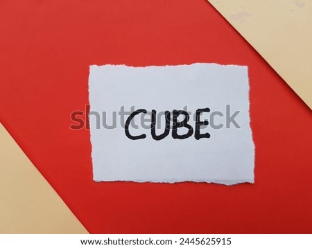 Cube writting on paper background.