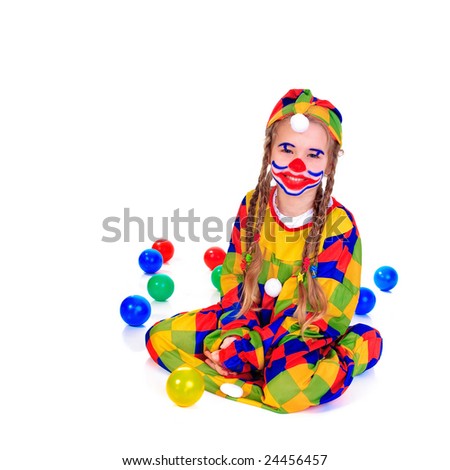 Young girl as jester on white background