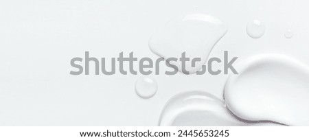 samples of cosmetic care products smear of cream and gel texture on a light background