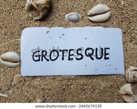 Grotesque writting on beach sand background.