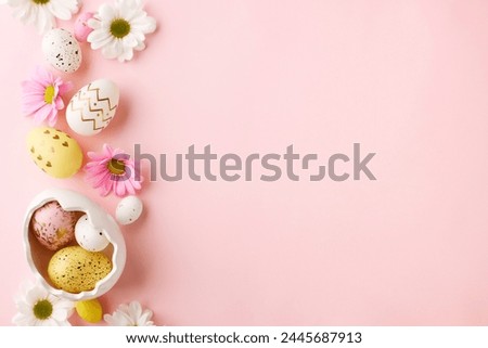 Pastel Easter: eggs and flowers awaiting spring wishes. Top view photo of decorated eggs, ceramic bunny, chrysanthemums on pastel pink background with space for heartfelt Easter greetings