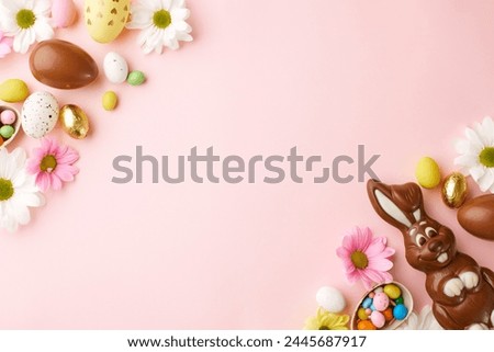 Chocolates and blooms: an Easter celebration. Top view photo of chocolate eggs, chocolate bunny, candies in eggshell, spring flowers on pastel pink background with space for custom text or ads