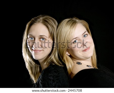 Beautiful Blond twin sisters posing