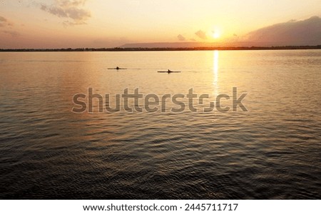 Canoeists at sunset, Ortigia, Sicily, Italy, Mediterranean, Europe