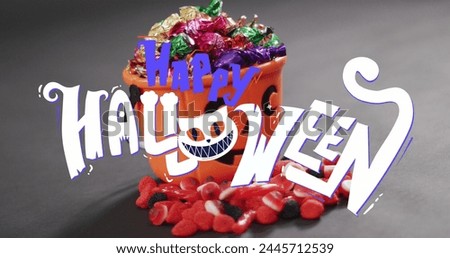 Image of happy halloween text over orange pumpkin bucket with sweets. halloween tradition and celebration concept digitally generated image.