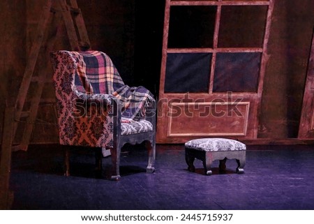 Image of a checkered plaid on an old chair stepladder and ottoman