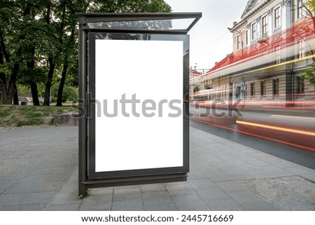 Mockup Of Bus Stop Billboard Display. Outdoor Advertising Poster Lightbox With Bright Car Light Trails On The City Street
