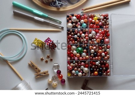 Various craft supplies on white background. Supplies for jewelry making, drawing and needlework. Flat lay.