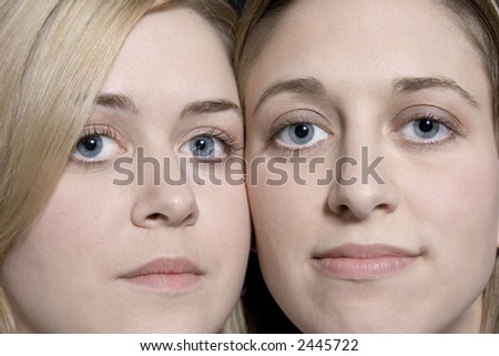Beautiful Blond twin sisters faces closeup