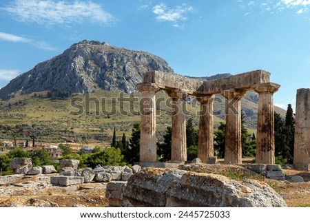 The archaic temple of Apollo, in ancient Corinth, Greece. It was built with monolithid doric columns, around 530 BC. Royalty-Free Stock Photo #2445725033