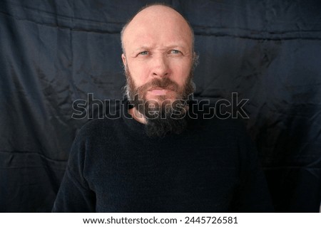 Men's beard. The guy's face is large. Brutal macho. Mustache and beard. Barber. Lumberjack. Portrait of a handsome man with a beard                                Royalty-Free Stock Photo #2445726581