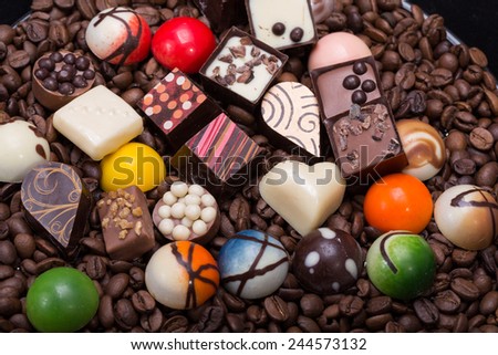 Set of a various chocolate pralines and coffee beans