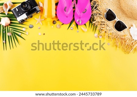 Vacation planning simple theme of chillout attributes - straw hat sunglasses flip flops film camera and palm leaves on uniform yellow background flat lay with copy-space