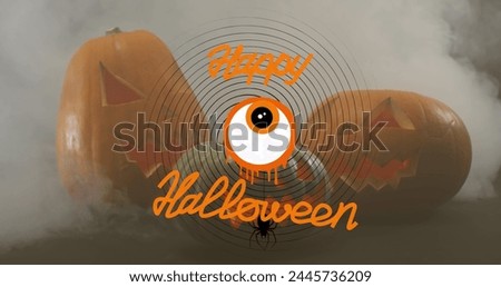 Happy halloween text banner with scary eye icon against against smoke effect over pumpkins. halloween festivity and celebration concept