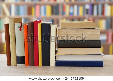 stack of books on table in library, space for text, education, school, history,colors,study,