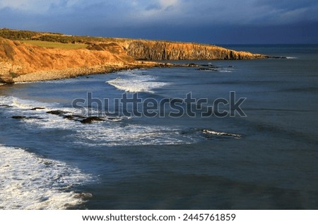 Whin Sill outcrop, Northumberland coast, England, United Kingdom, Europe Royalty-Free Stock Photo #2445761859