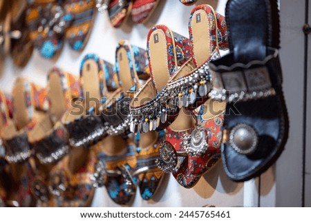 Indian Leather slipper designs on display for sale.
