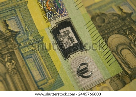 Euro symbol. A fragment of a 100 euro banknotes with a hologram. High quality photo