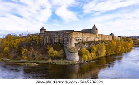 Russian border. Fortres in Ivangorod. Beautiful colored autumn. Royalty-Free Stock Photo #2445786391