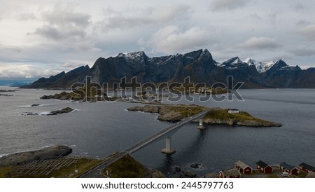 Famous photography spot of Hamnoy red rorbu fishing houses from the nearby bridge.  Located in Lofoten, Norway in the Arctic circle.  A famous fishing village.