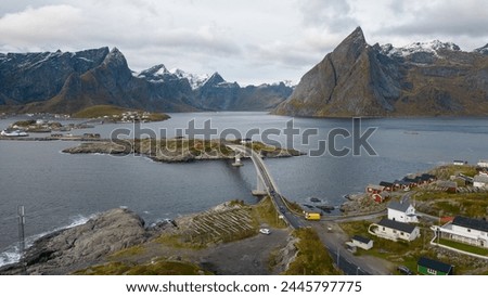 Famous photography spot of Hamnoy red rorbu fishing houses from the nearby bridge.  Located in Lofoten, Norway in the Arctic circle.  A famous fishing village. Royalty-Free Stock Photo #2445797775