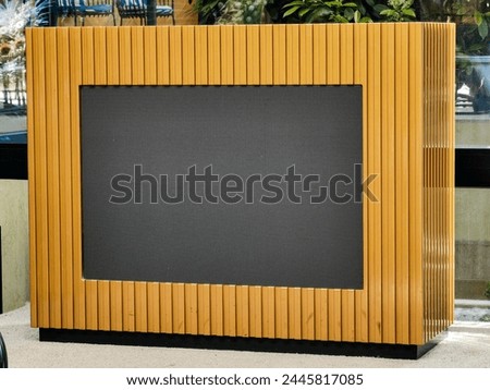 Innovative, wooden brown desk. Abstract tv display illusion with black center. 