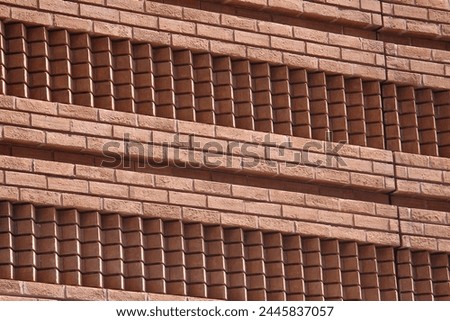 Sun falling on brick wall creating shadow effect