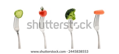 A image of fresh vegetables on forks