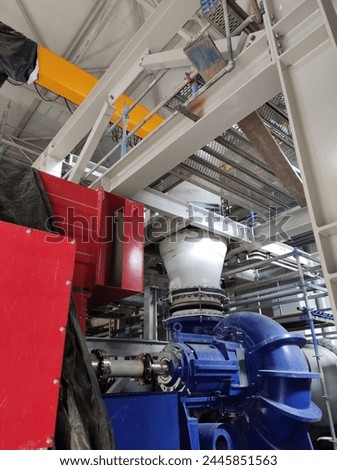 Industrial photo showing pump and piping