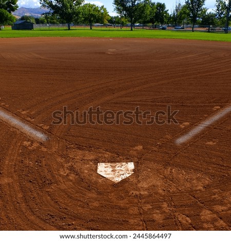 Baseball homeplate with painted baselines on ball diamond